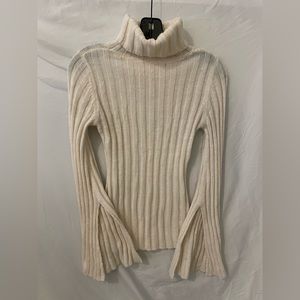 Crème woven turtleneck with slit sleeves